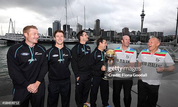 In front of the Auckland skyline are current Black Caps Martin Guptill, Matt Henry, Mitchell McClenaghan and Nathan McCullum with 1992 Black Cap...