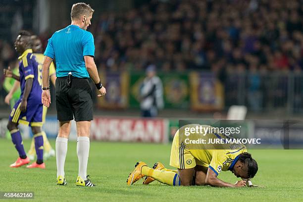 Didier Drogba of Chelsea lies on the ground after he was injured during the UEFA Champions League Group G football match between NK Maribor and...