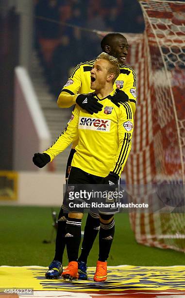Alex Pritchard of Brentford celebrates scoring the third goal from the penalty spot during the Sky Bet Championship match between Nottingham Forest...
