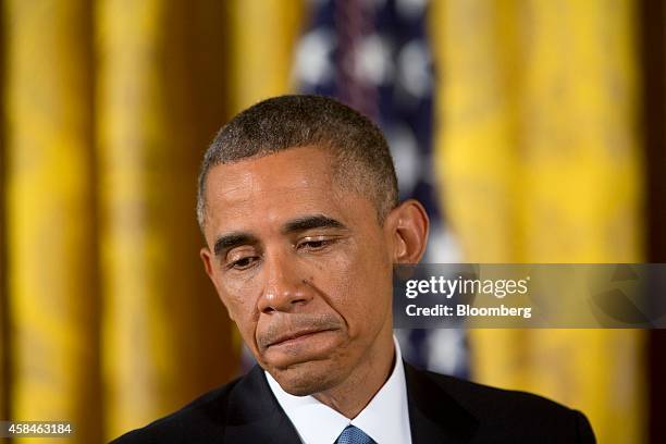 President Barack Obama pauses while speaking during a news conference in the East Room of the White House in Washington, D.C., U.S., on Wednesday,...