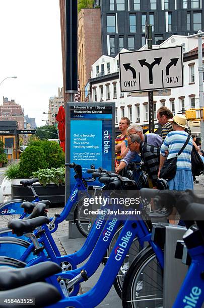 people at citi bike station, meatpacking district, new york city - bicycle rack stock pictures, royalty-free photos & images