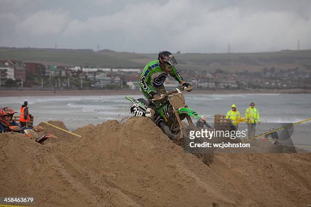 motocross dirt bike race on the beach at weymouth - weymouth esplanade stock pictures, royalty-free photos & images
