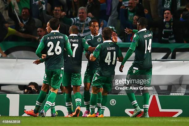 Islam Slimani of Sporting Lisbon celebrates scoring their fourth goal with team mates during the UEFA Champions League Group G match between Sporting...