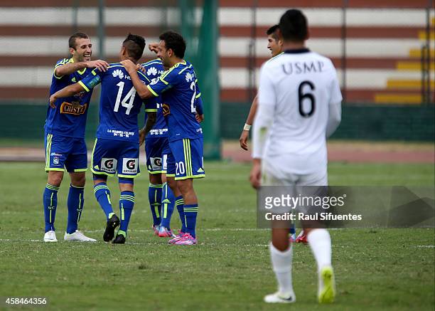 Yoshimar Yotun of Sporting Cristal celebrates with teammates after scoring the first goal of his team against San Martin during a match between San...