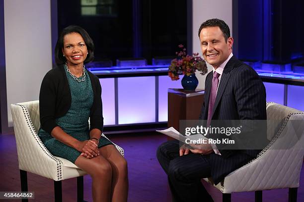 Condoleezza Rice is interviewed by host Brian Kilmeade during a taping of "FOX And Friends" at FOX Studios on November 5, 2014 in New York City.