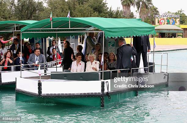 Camilla, Duchess of Cornwall sits on a canal boat with the First Lady of Monterrey Gretta Salinas de Medina at a an Official Welcome at the Parque...