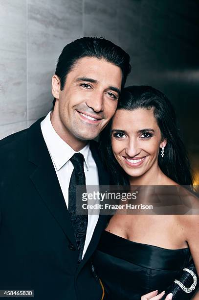 Gilles Marini and wife Carole Marini poses for a portrait at the amfAR LA Inspiration Gala on October 29, 2014 in Los Angeles, California.
