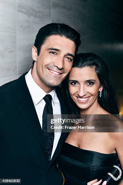 Gilles Marini and wife Carole Marini poses for a portrait at the amfAR LA Inspiration Gala on October 29, 2014 in Los Angeles, California.