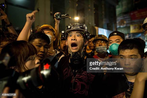 Pro-democracy protester shouts at police officers in Mongkok district on November 6, 2014 in Hong Kong. Pro-democracy protesters staged a rally on...