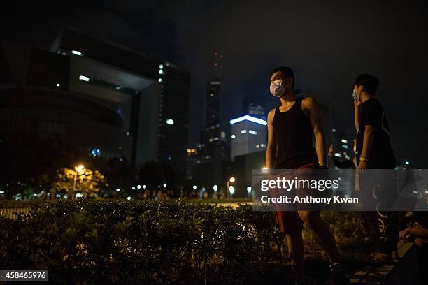 Pro-democracy protesters stand on a street near Hong Kong Government Complex in Admiralty district on November 6, 2014 in Hong Kong. Pro-democracy...