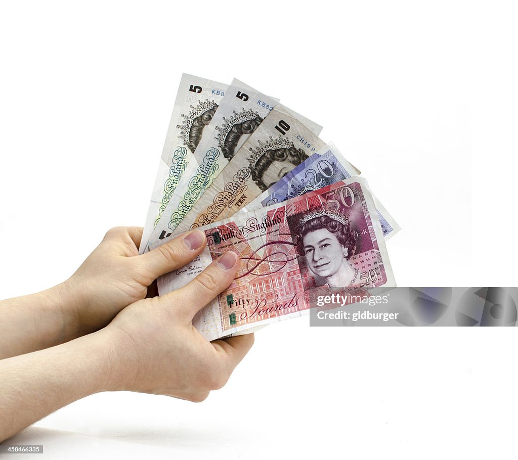 Holding British banknotes