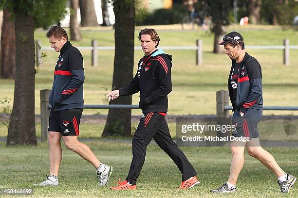 Coach James Hird and his newly appointed assistant coaches Mark Neeld and Mark Harvey walk off from their time trial during the Essendon Bombers AFL...