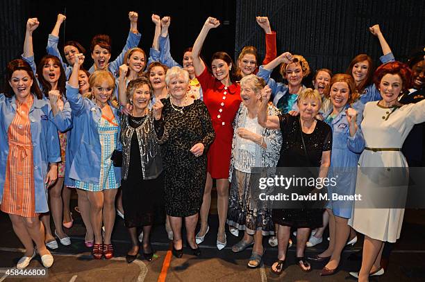 Cast member Gemma Arterton poses with the ladies of the "Made In Dagenham" company and real-life Dagenham strikers Gwen Davis, Eileen Pullen, Vera...