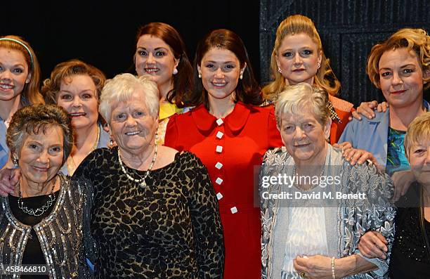 Cast member Gemma Arterton poses with the ladies of the "Made In Dagenham" company and real-life Dagenham strikers Gwen Davis, Eileen Pullen and Vera...