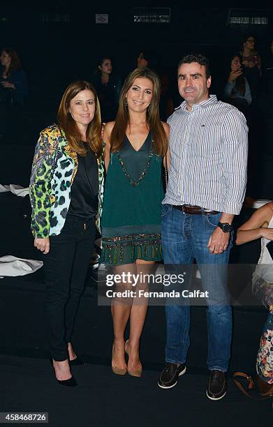 Margareth Menegotti, left, Sandra Menegotti and Alexandre Menegotti, right, attend the Triton fashion show during Sao Paulo Fashion Week Winter 2015...