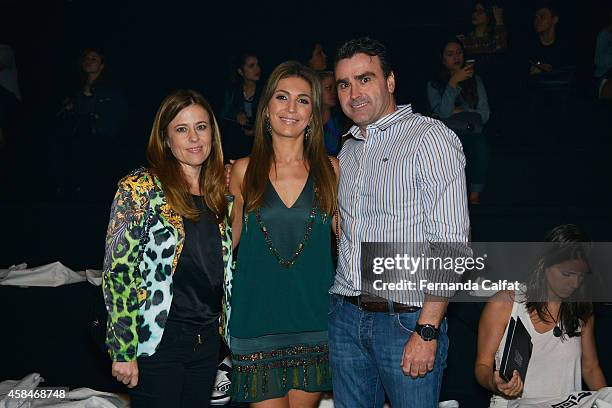 Margareth Menegotti, left, Sandra Menegotti and Alexandre Menegotti, right, attend the Triton fashion show during Sao Paulo Fashion Week Winter 2015...