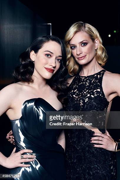 Kat Dennings and Beth Behrs pose for a portrait at the amfAR LA Inspiration Gala on October 29, 2014 in Los Angeles, California.