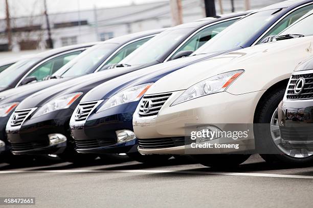 row of new lexus vehicles at car dealership - lexus car stock pictures, royalty-free photos & images