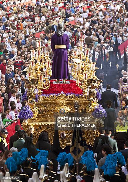 jesus christ religious parade during holy monday in sevilla - holy week stock pictures, royalty-free photos & images