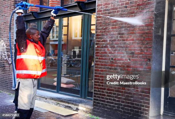 pressure on graffiti - cleaning graffiti stock pictures, royalty-free photos & images