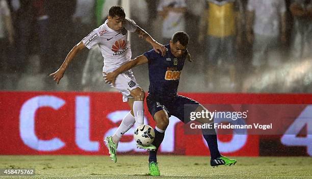 Rildo of Santos fights for the ball with Ceara of Cruzeiro during the match between Santos and Cruzeiro for Copa do Brasil 2014 at Vila Belmiro...