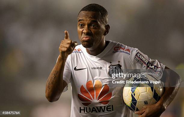 Robinho of Santos celebrates the second goal during the match between Santos and Cruzeiro for Copa do Brasil 2014 at Vila Belmiro Stadium on November...