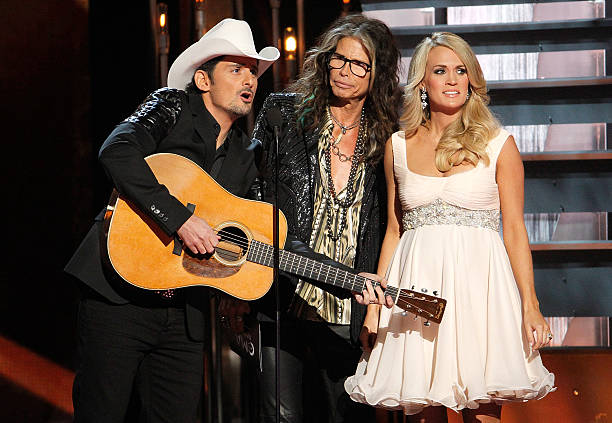 Brad Paisley, Steven Tyler, and Carrie Underwood perform during the 48th annual CMA awards at the Bridgestone Arena on November 5, 2014 in Nashville,...