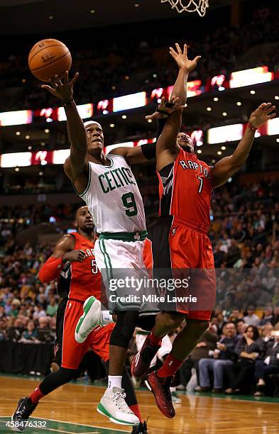 Rajon Rondo of the Boston Celtics drives to the basket in the first half against Kyle Lowry of the Toronto Raptors at TD Garden on November 5, 2014...