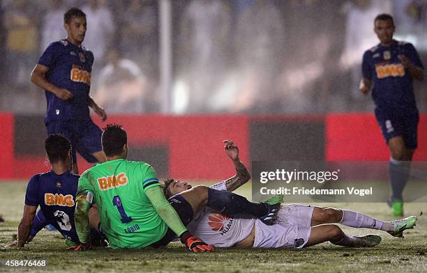 Rildo of Santos fights for the ball with Fabio of Cruzeiro during the match between Santos and Cruzeiro for Copa do Brasil 2014 at Vila Belmiro...