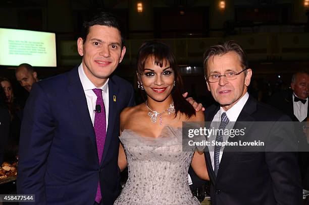 President and CEO David Miliband, opera singer Danielle de Niese, and ballet dancer and actor Mikhail Baryshnikov attend the Annual Freedom Award...