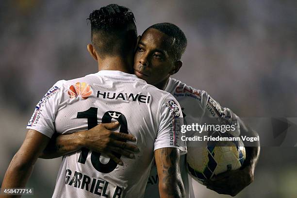 Robinho of Santos celebrates the second goal with Gabriel during the match between Santos and Cruzeiro for Copa do Brasil 2014 at Vila Belmiro...