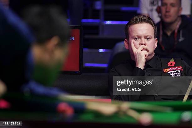 Shaun Murphy of England reacts against Marco Fu of China during their 1/8 match on day three of the 2014 Dafabet Champion of Champions at The Ricoh...