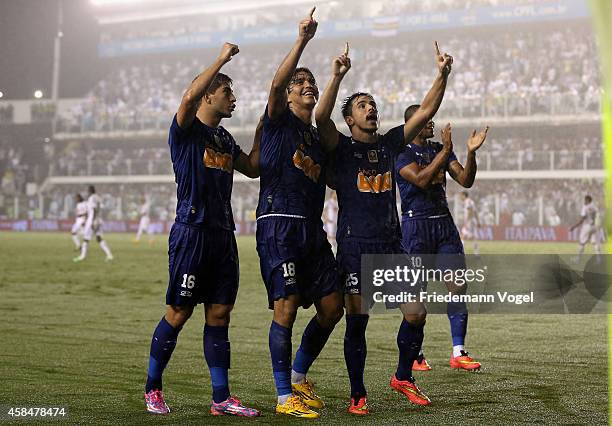 The team of Cruzeiro celebrates scoring the second goal during the match between Santos and Cruzeiro for Copa do Brasil 2014 at Vila Belmiro Stadium...