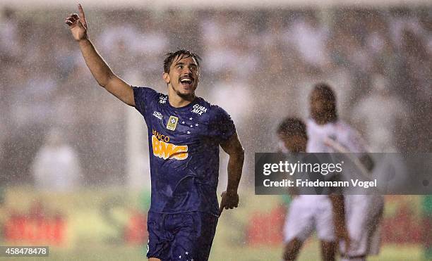 William of Cruzeiro celebrates scoring the third goal during the match between Santos and Cruzeiro for Copa do Brasil 2014 at Vila Belmiro Stadium on...