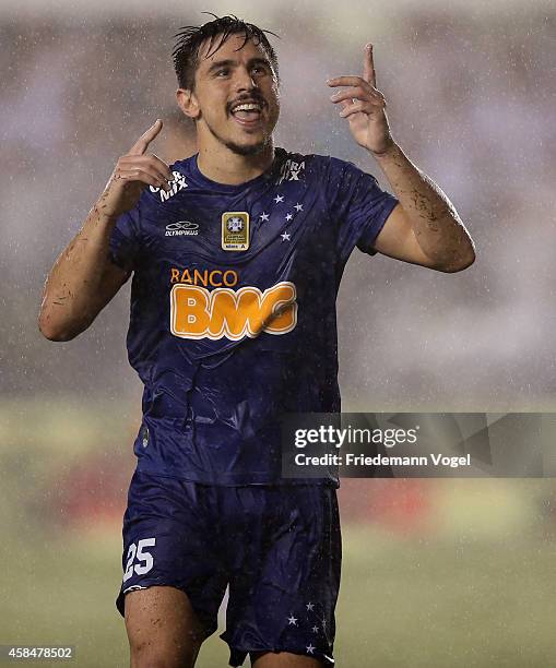 William of Cruzeiro celebrates scoring the third goal during the match between Santos and Cruzeiro for Copa do Brasil 2014 at Vila Belmiro Stadium on...