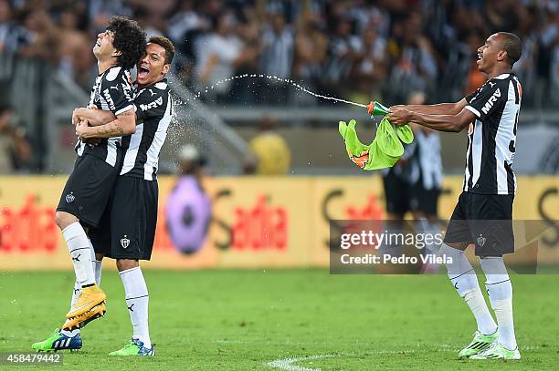 Luan, Alex Silva and Eduardo of Atletico MG celebrates the winning after the game against Flamengo during a match between Atletico MG and Flamengo as...