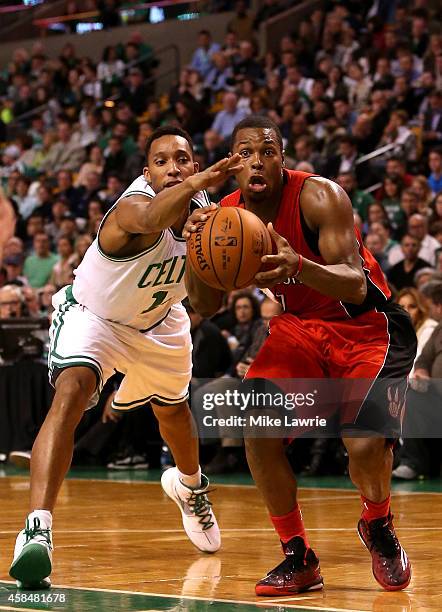 Kyle Lowry of the Toronto Raptors handles the ball against Evan Turner of the Boston Celtics in the second half at TD Garden on November 5, 2014 in...