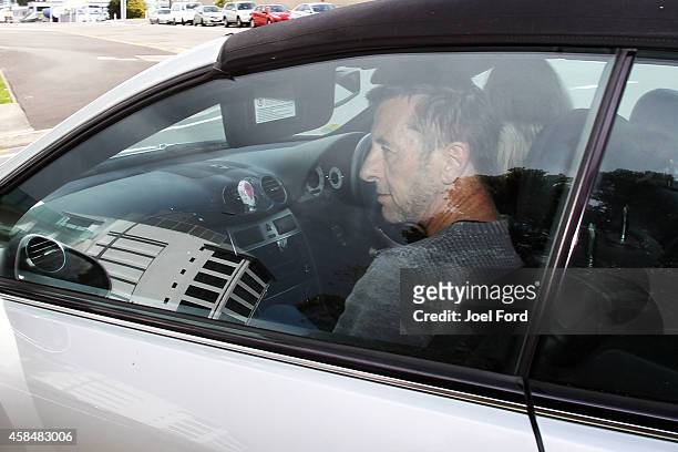 Drummer Phil Rudd leaves Tauranga District Court after being charged with attempting to procure murder at Tauranga District Court on November 6, 2014...