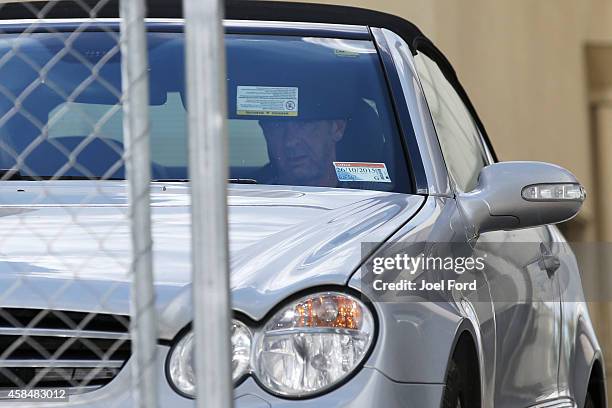 Drummer Phil Rudd leaves Tauranga District Court after being charged with attempting to procure murder at Tauranga District Court on November 6, 2014...