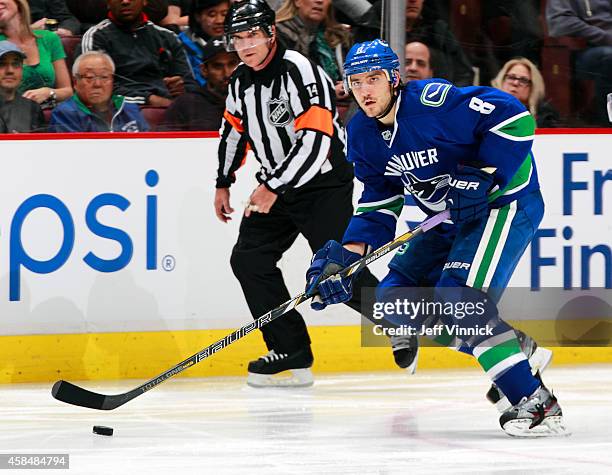 Christopher Tanev of the Vancouver Canucks skates up ice during their game against the Carolina Hurricanes at Rogers Arena October 28, 2014 in...