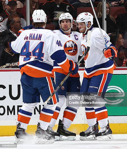 Calvin de Haan, John Tavares and Kyle Okposo of the New York Islanders celebrate Tavares' first period goal during the game against the Anaheim Ducks...