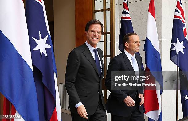 Netherlands Prime Minister Mark Rutte and Australian Prime Minister Tony Abbott arrive at a joint press conference on November 6, 2014 in Canberra,...