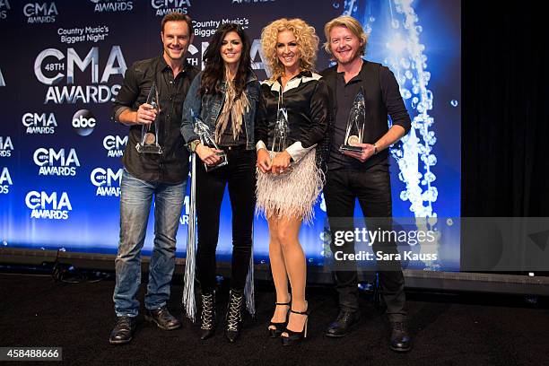 Jimi Westbrook, Karen Fairchild, Kimberly Schlapman and Phillip Sweet of Little Big Town win Vocal Group of the Year at the 48th annual CMA Awards at...