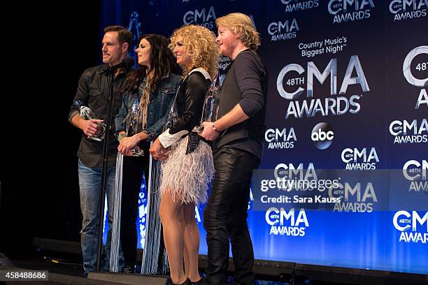 Jimi Westbrook, Karen Fairchild, Kimberly Schlapman and Phillip Sweet of Little Big Town win Vocal Group of the Year at the 48th annual CMA Awards at...