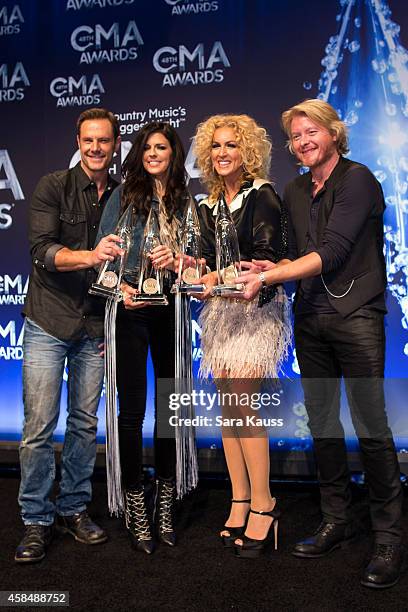 Jimi Westbrook, Karen Fairchild, Kimberly Schlapman and Phillip Sweet of Little Big Town win Vocal Group of the Year at the 48th annual CMA Awards at...