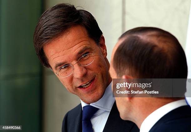 Prime Minister of The Netherlands Mark Rutte looks towards Australian Prime Minster Tony Abbott as he speaks during a media conference at Parliament...