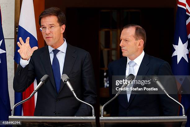 Prime Minister of The Netherlands Mark Rutte speaks as Australian Prime Minster Tony Abbott listens on during a media conference at Parliament House...