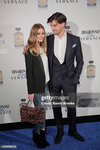 Actress Olivia Palermo with Model Johannes Huebl attend the Disaronno Wears Versace launch event at Root Drive In on November 5, 2014 in New York...