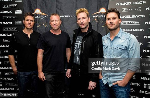 Daniel Adair, Chad Kroeger, Mike Kroeger and Ryan Peake of Nickelback pose at the special announcement and live performance at the House of Blues on...