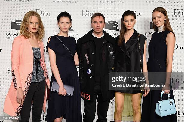 Models Hanne Gaby Odiele and Katlin Aas, Fashion designer Raf Simons and models Diana Moldovan and Irina Liss attend the Guggenheim International...